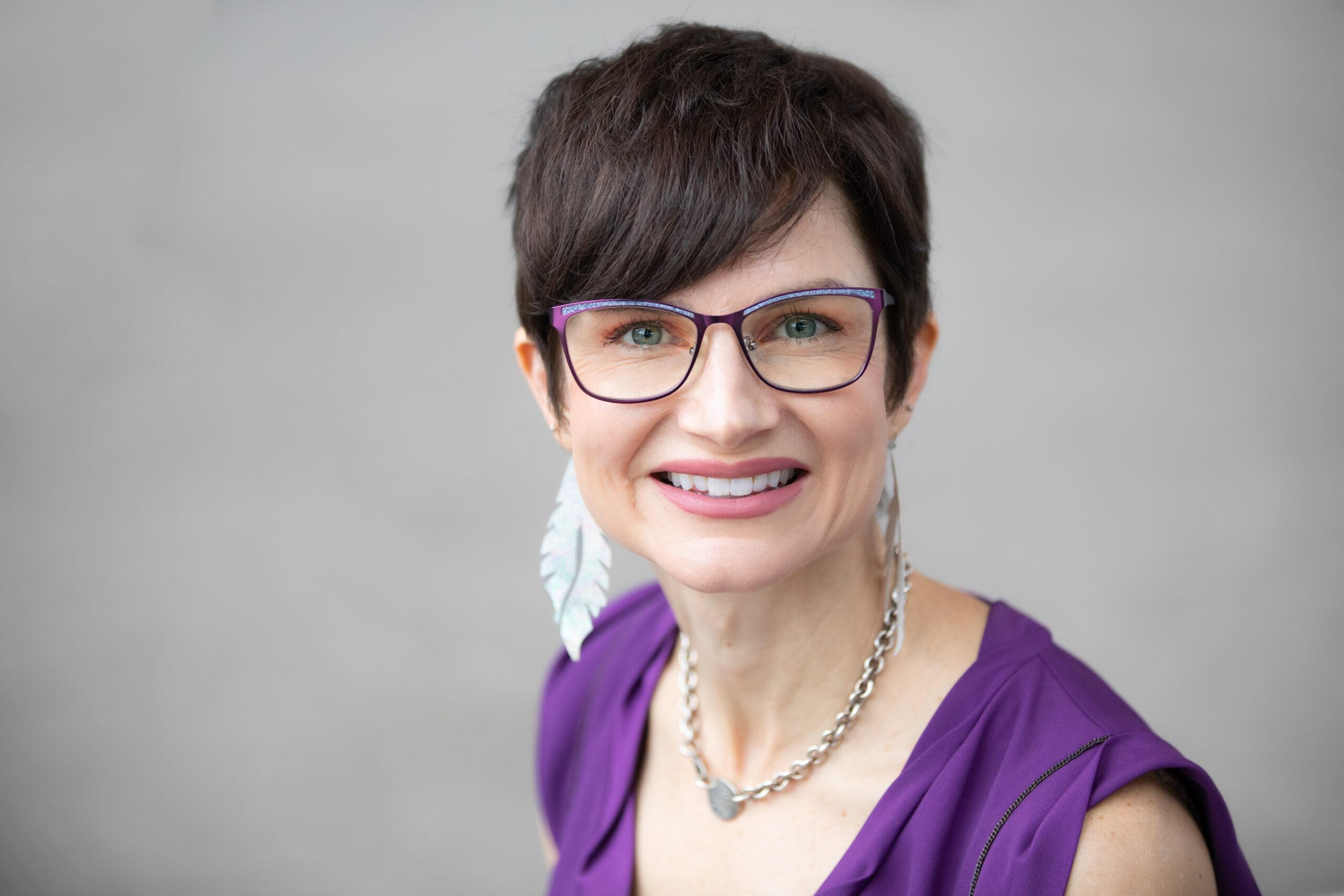 Marcey Rader headshot with glasses