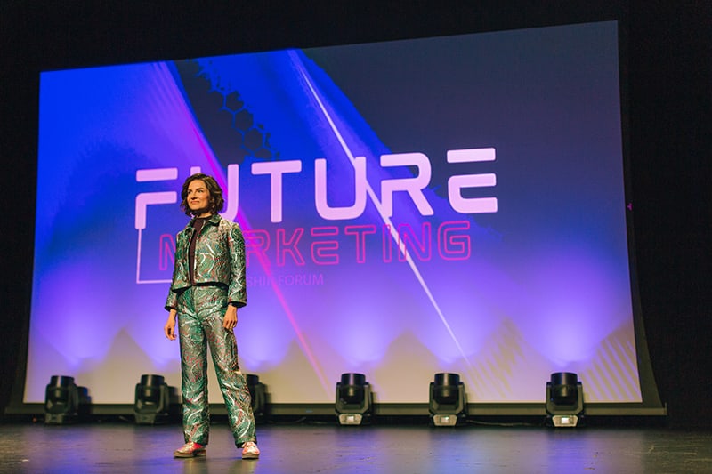 Suit standing on stage