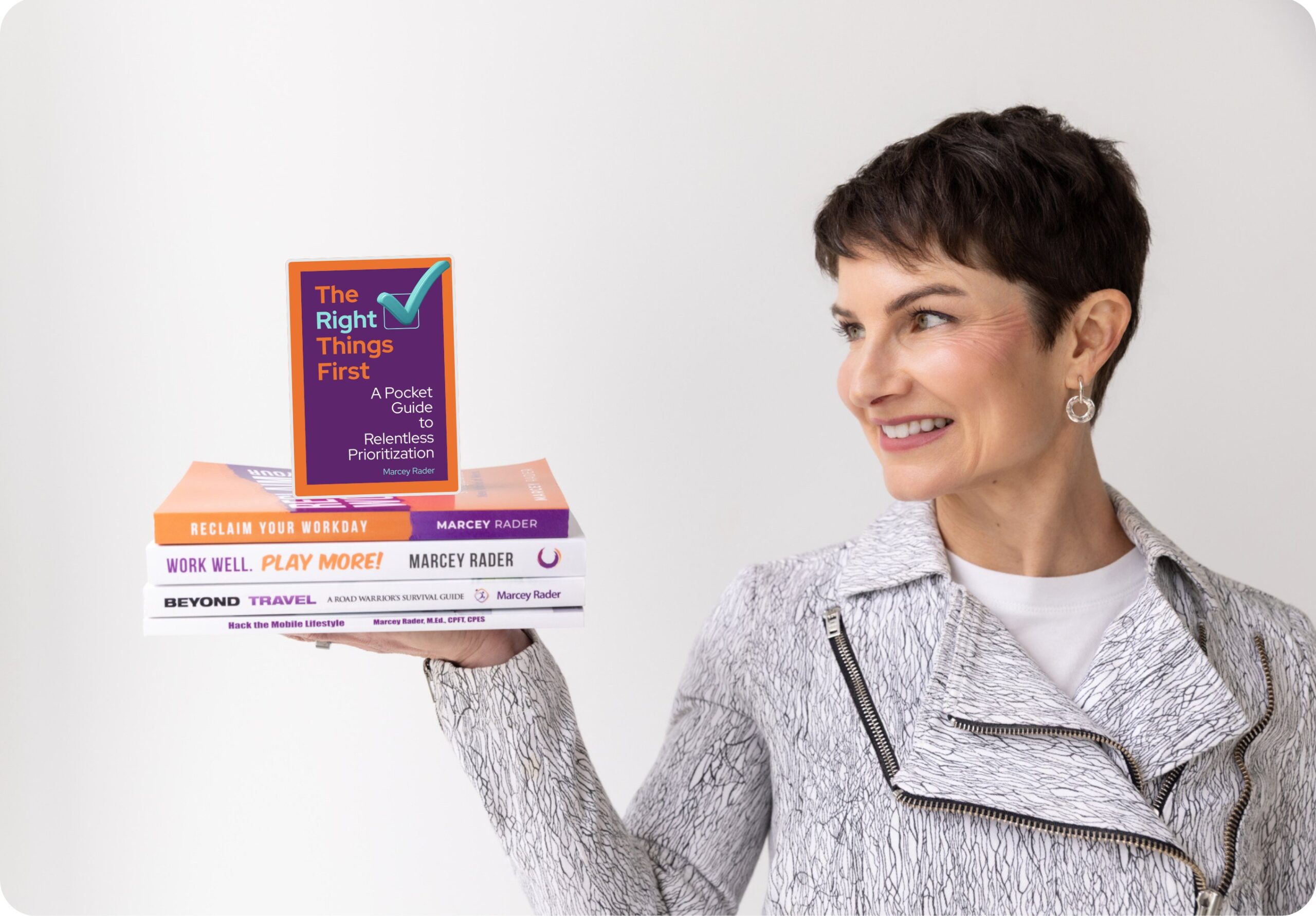 Marcey-Rader-Author-Looking-At-Books Marcey Speaking
