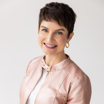 Marcey-Rader--Keynote-Speaker-Pink-Jacket thumb-300-LANDSCAPE-IMAGES-BRAND-color-corrected-MARCEY-